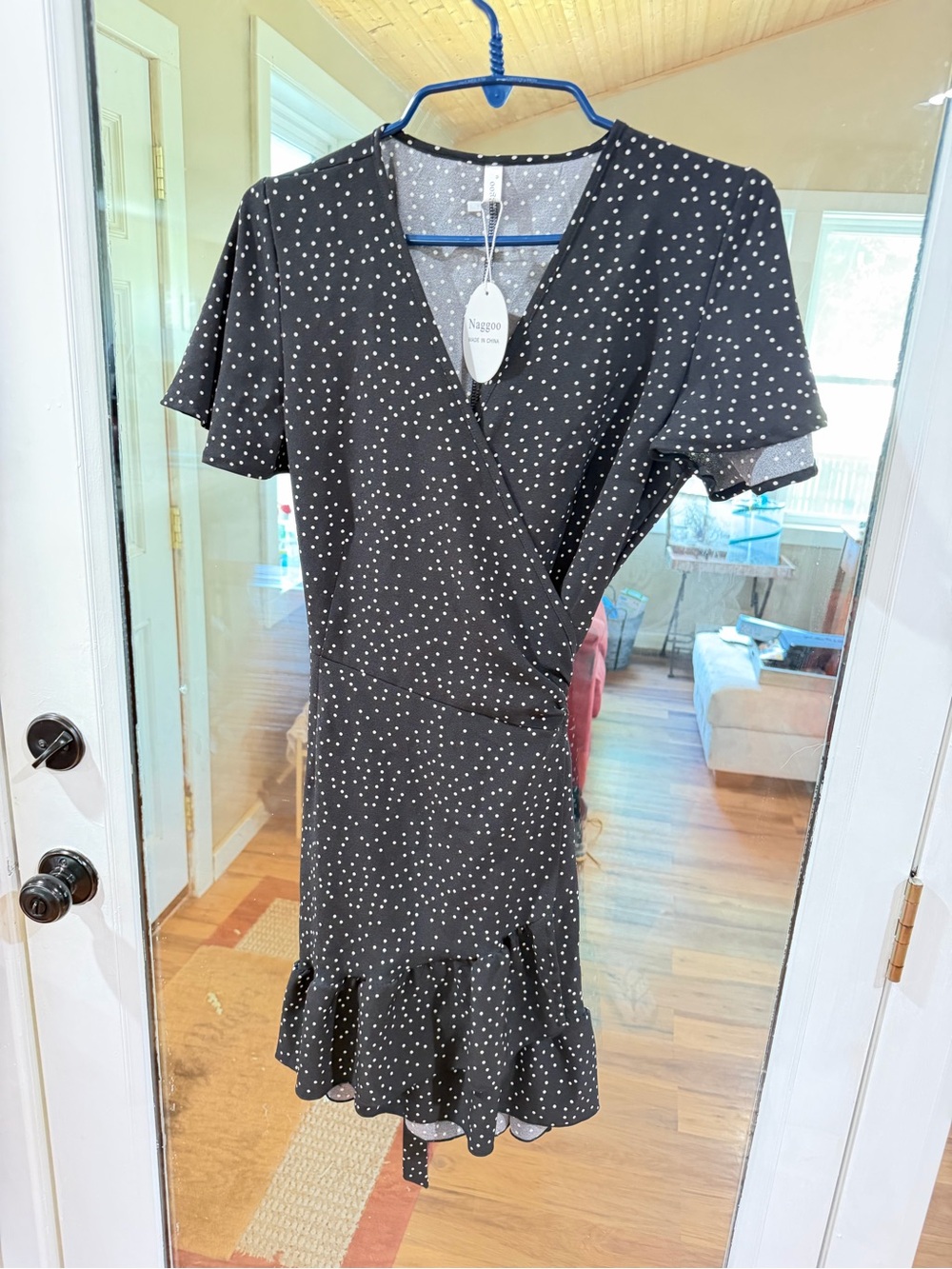 Naggoo Polka Dot Wrap-Style Black Dress with Ruffle Hem